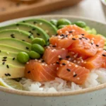 Close-up of a vibrant salmon poke bowl recipe with fresh ingredients.